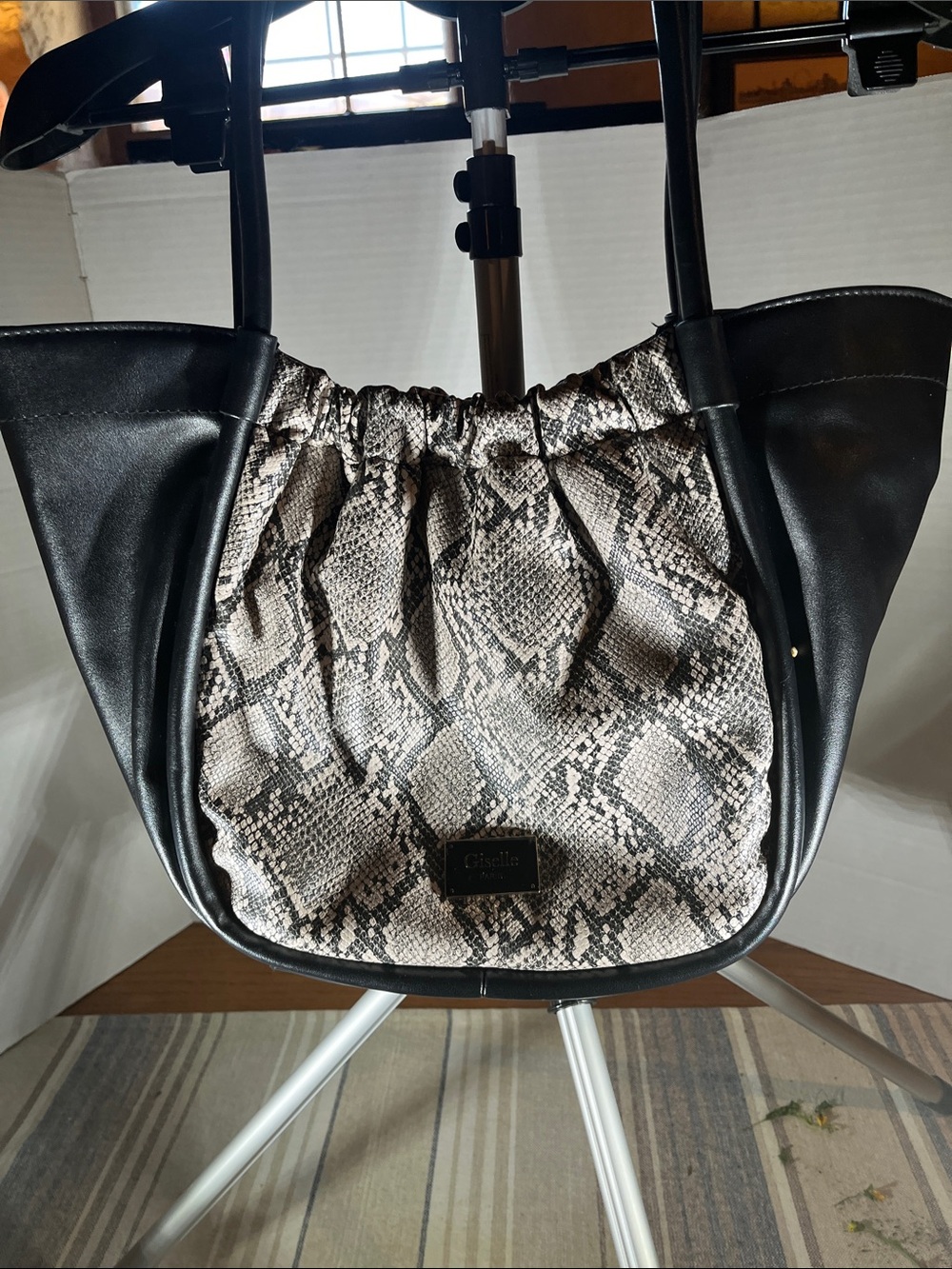 Snake-Print Drawstring Shoulder Bag in Black and Taupe